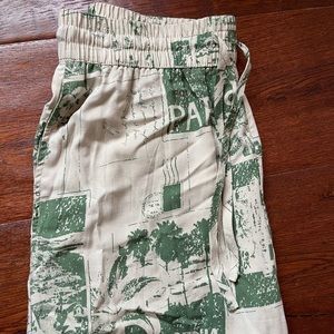 URBAN OUTFITTERS wide leg green newspaper style print